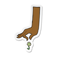 sticker of a cartoon hand picking flower