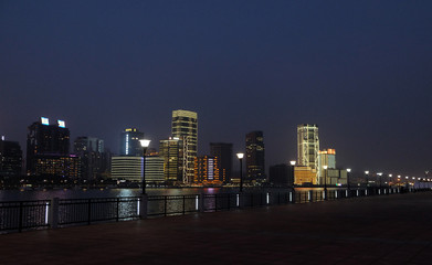 Night view to the riverside business center in Shanghai, China