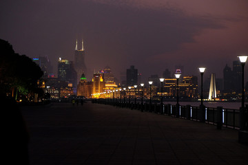 Obraz premium Night view to the riverside business center in Shanghai, China