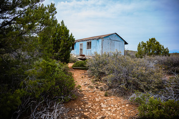 Fototapeta na wymiar Abandoned Blue House in Arizona Mountains