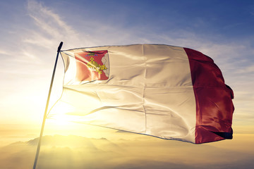 Vologda oblast of Russia flag waving on the top sunrise mist fog