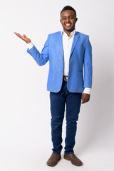Full body shot of happy young African businessman showing something