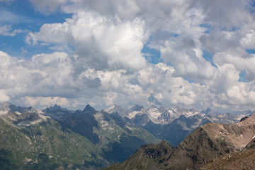 Panorama of mountains scene with dramatic cloudy sky in national park of Dombay
