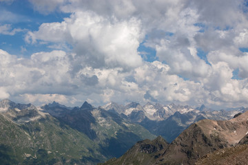 Obraz premium Panorama of mountains scene with dramatic cloudy sky in national park of Dombay