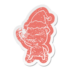angry polar bear cartoon distressed sticker of a wearing santa hat