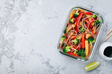 Chicken teriyaki stir fry meal prep containers with broccoli, carrots, rice or soba noodles