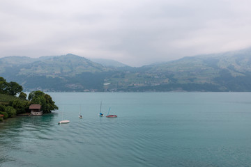 View on lake Thun and mountains from ship in city Spiez, Switzerland