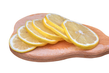 Lemon slices on a wooden board isolate on white background
