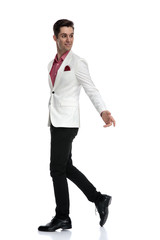 smiling young elegant man trying to interact with someone