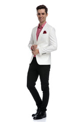 young smart casual man fixing his sleeve