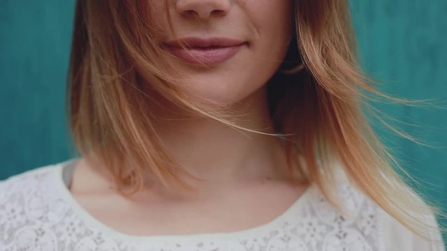 Closeup portrait of wind blows beautiful woman hair