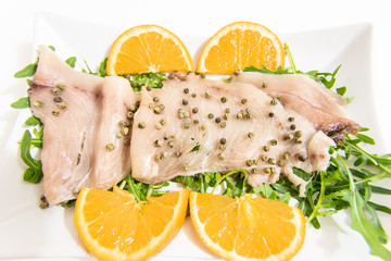 Carpaccio of fresh Mediterranean swordfish with green pepper, chives and a few drops of orange juice