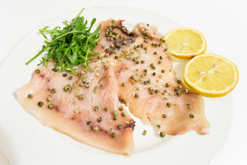Carpaccio of fresh Mediterranean swordfish with green pepper, chives and a few drops of orange juice