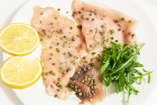 Carpaccio of fresh Mediterranean swordfish with green pepper, chives and a few drops of orange juice