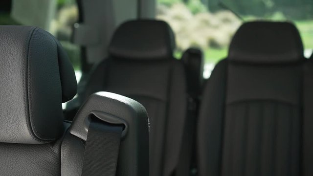 SLOWMO - Interior of luxury minivan black leather seats