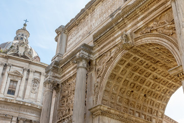 Fototapeta na wymiar Arch of Septimius Severus closeup in Forum Romanum. Rome. Italy.