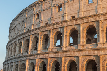 Fototapeta premium The arcs of Colosseum in sunset light. Rome Italy. Horizontally