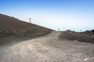 Mountain road on Etna volcano. Mount Etna landscape. Sicily, Italy