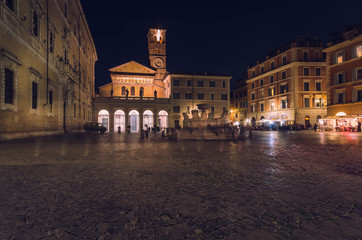 Fototapeta na wymiar Piazza di Santa Maria in Trastevere, one of the Rome's loveliest location at nighttime.
