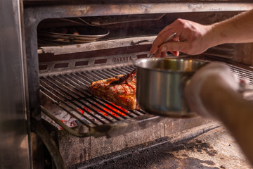 Food concept - Steak is coated with sauce