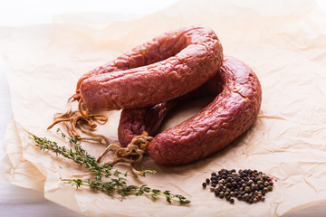 Food, national cuisine and delicious concept - sausages made with horse meat