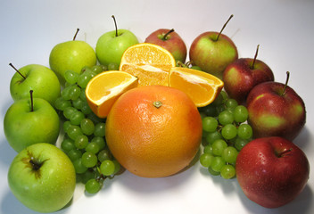 Apples, grapes, oranges and grapefruit. How much juiciness and vivid taste in these beautiful, tasty gifts of nature.