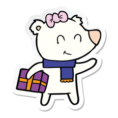 sticker of a female polar bear with christmas present