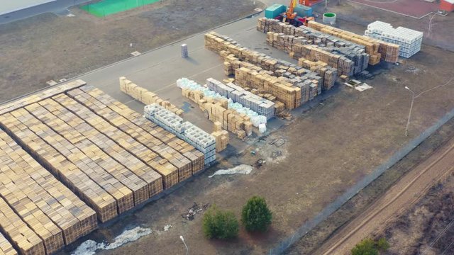 Aerial view of the outside storage of wooden pallets on the logistics park territory