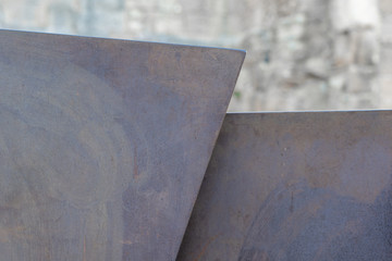 Metal plates slightly rusted forming angular shapes