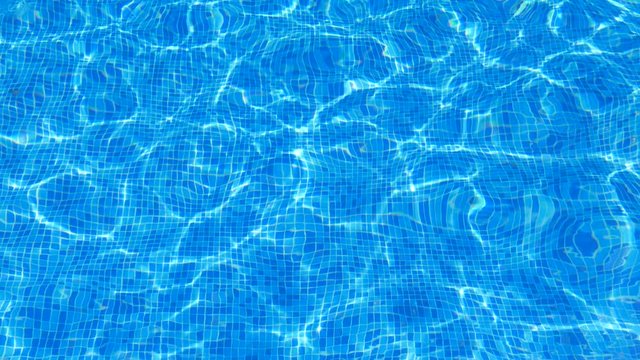 Ripple reflection on a tiled pool bottom