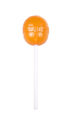 Orange round lollipop isolated on white. Sweet sugar candy