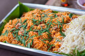 Thai style noodles , Pad thai.  Rice noodles with shrimps and vegetables close-up on the table. Pad thai noodle or stir-fried rice noodle. street food Bangkok in Thailand.