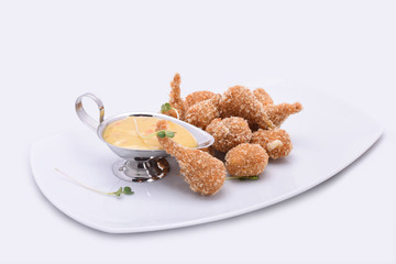 Breaded poultry meat. Dish on a white background