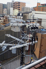 Fototapeta premium dangerous power lines in tokyo