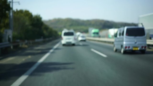 4K 24fps Dash Camera footage driving around Japan. A mix of Japanese highways and Japanese city streets. Unfocused to prevent anything from being recognizable.