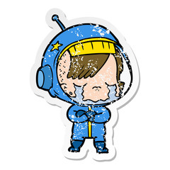 distressed sticker of a cartoon crying astronaut girl