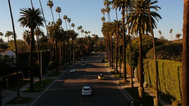 Drone footage. Flyingin the sunset over a beutiful street of Beverly hills, Los Angeles, California. Recorded with a DJI Spark 1080p 30fps