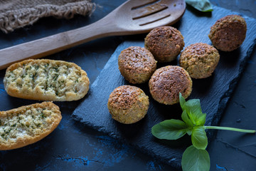 Vegan croquettes on slate stone