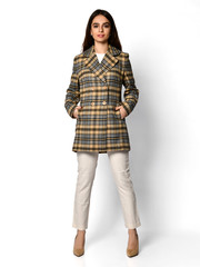 Young beautiful woman posing in new spring fashion casual green yellow grey jacket coat hat full body