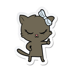 sticker of a cute cartoon cat with bow