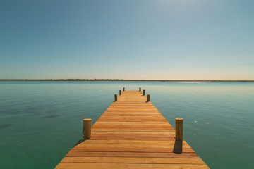 Obraz premium Sunset in the wooden harbor in summer,Bacalar,Quintana Roo, Mexico.