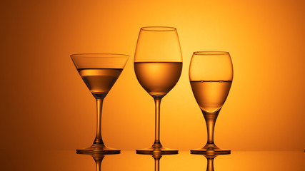 wine glasses dishes on a colored background