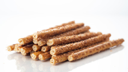 Sesame sticks on a white background