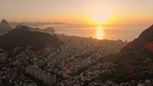 Rio De Janeiro panning cityscape of the sunset over the coast and Sugarloaf Mountain.
