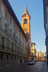 Fototapeta na wymiar Asti street with Sanctuary of San Giuseppe