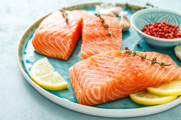 Seafood. Fresh raw salmon or trout fillets with ingredients