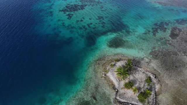 small isolated coral island in San Blas Islands Guna Yala Panama aerial view