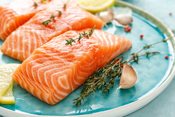 Seafood. Fresh raw salmon or trout fillets with ingredients - 254247345