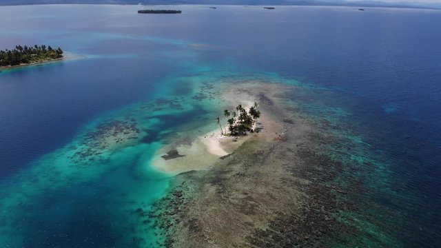 cinematic aerial view isolated tropical coral island in San Blas archipelago Guna Yala Panama