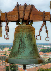Fototapeta premium Bronze bell on top of the church tower in Tuscany - 1